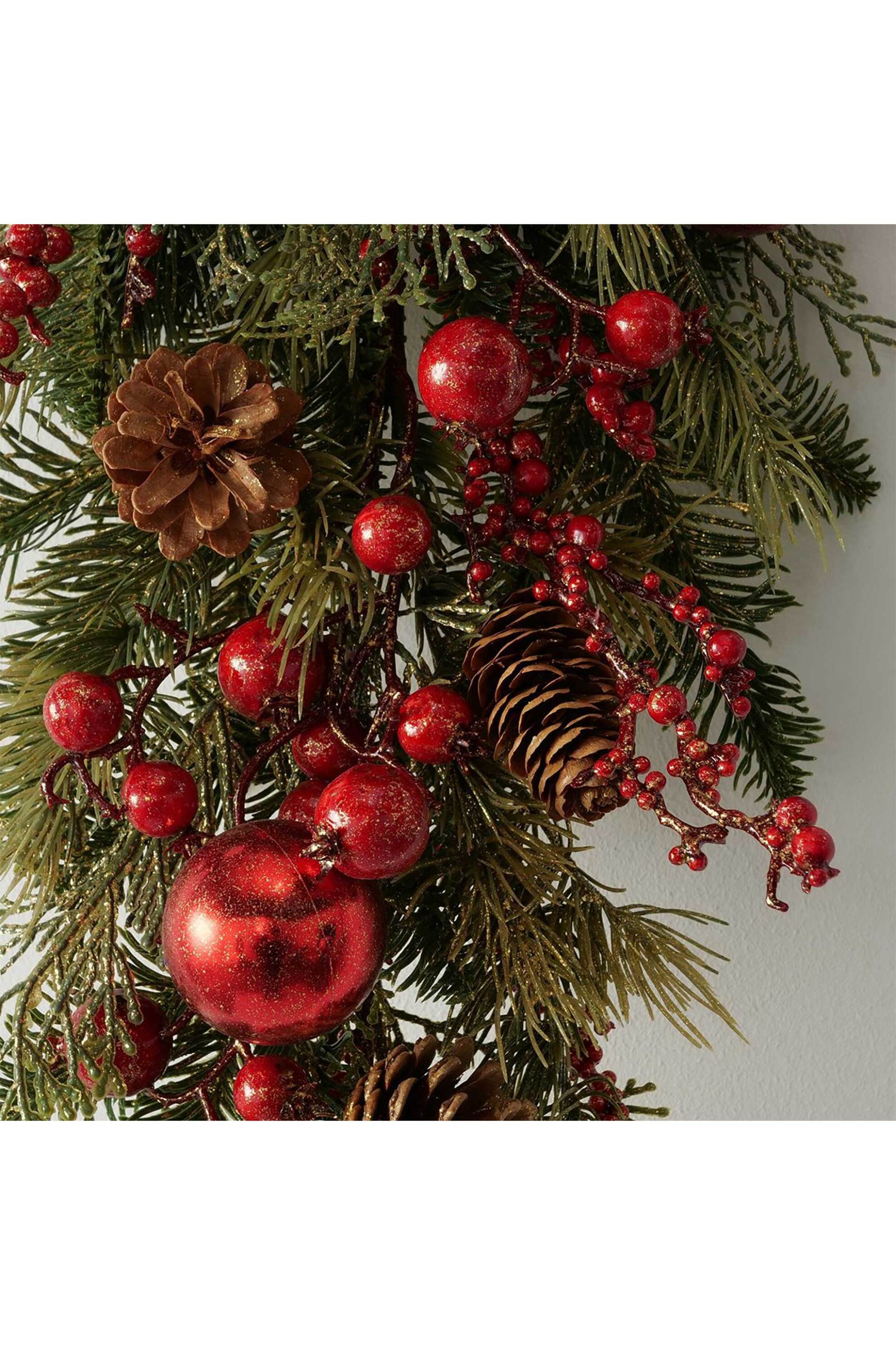 DOMUS HOMUS χριστουγεννιάτικο διακοσμητικό κρεμαστό κλαδί πεύκου με γκι 75 x 28 x 10 cm - 20-99-795 φωτογραφία