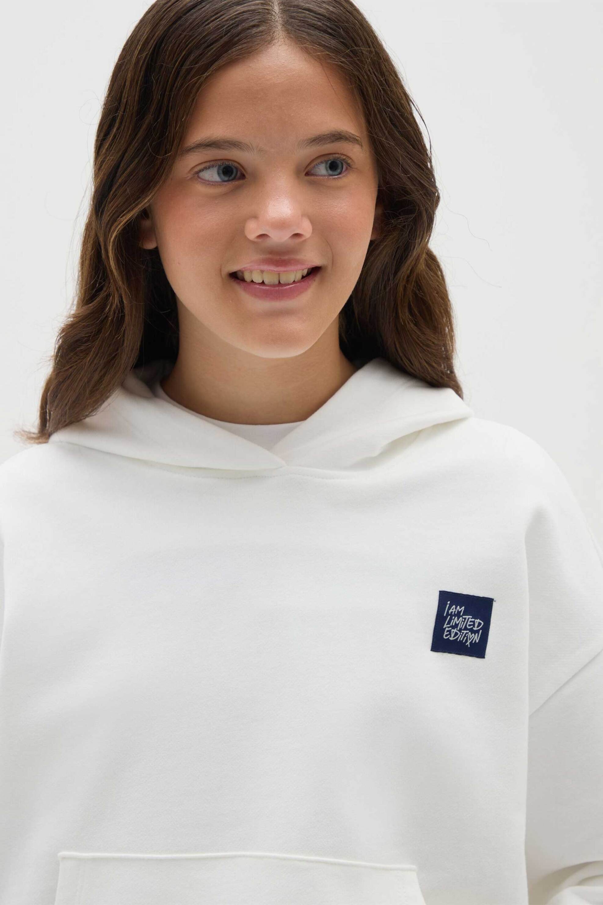 OVS παιδική μπλούζα φούτερ με κουκούλα και lettering Oversized - 002415377 Λευκό φωτογραφία