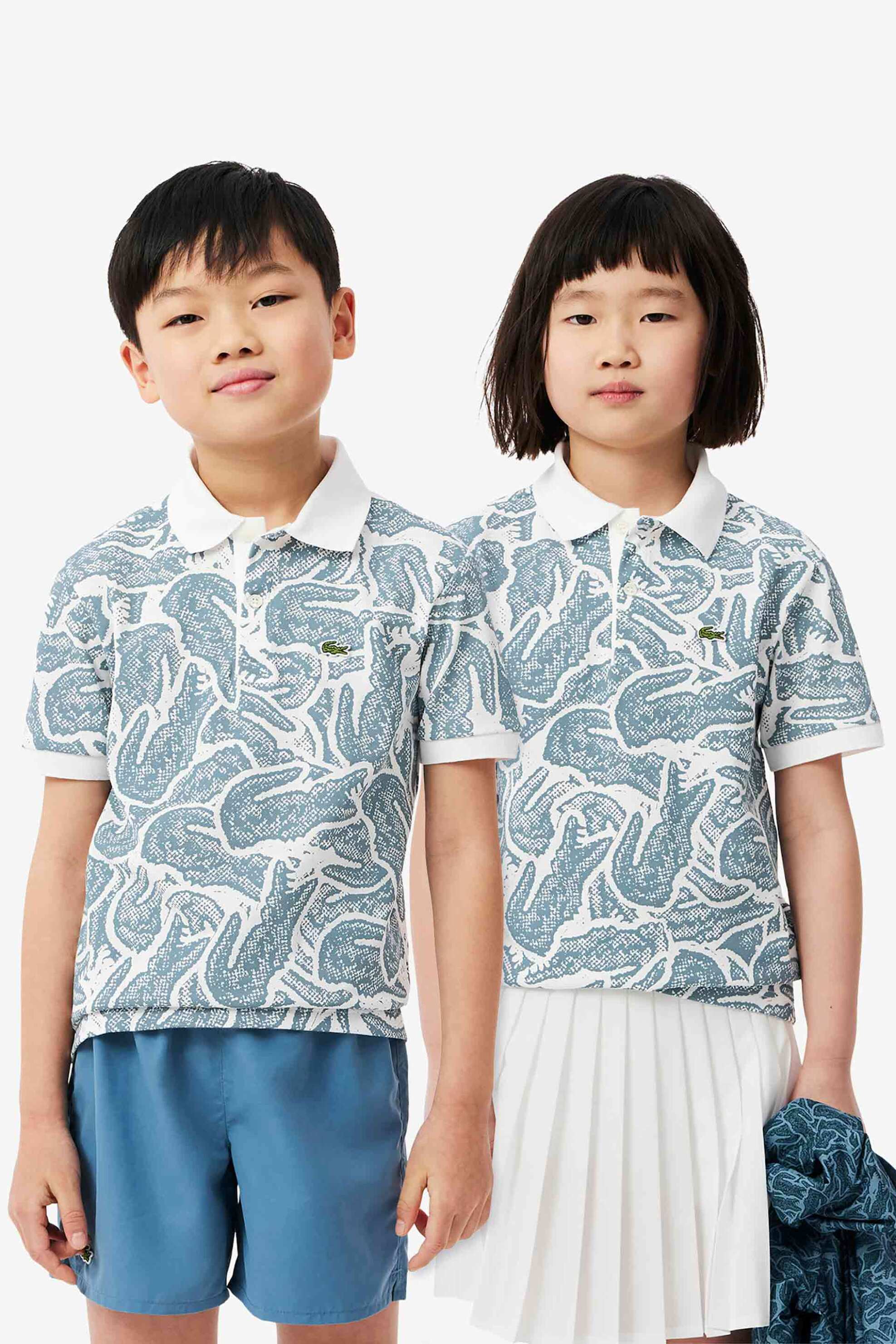 LACOSTE Lacoste παιδική μπλούζα πόλο πικέ κοντομάνικη με all-over crocodile print - PJ8466-00 Μπλε Ανοιχτό