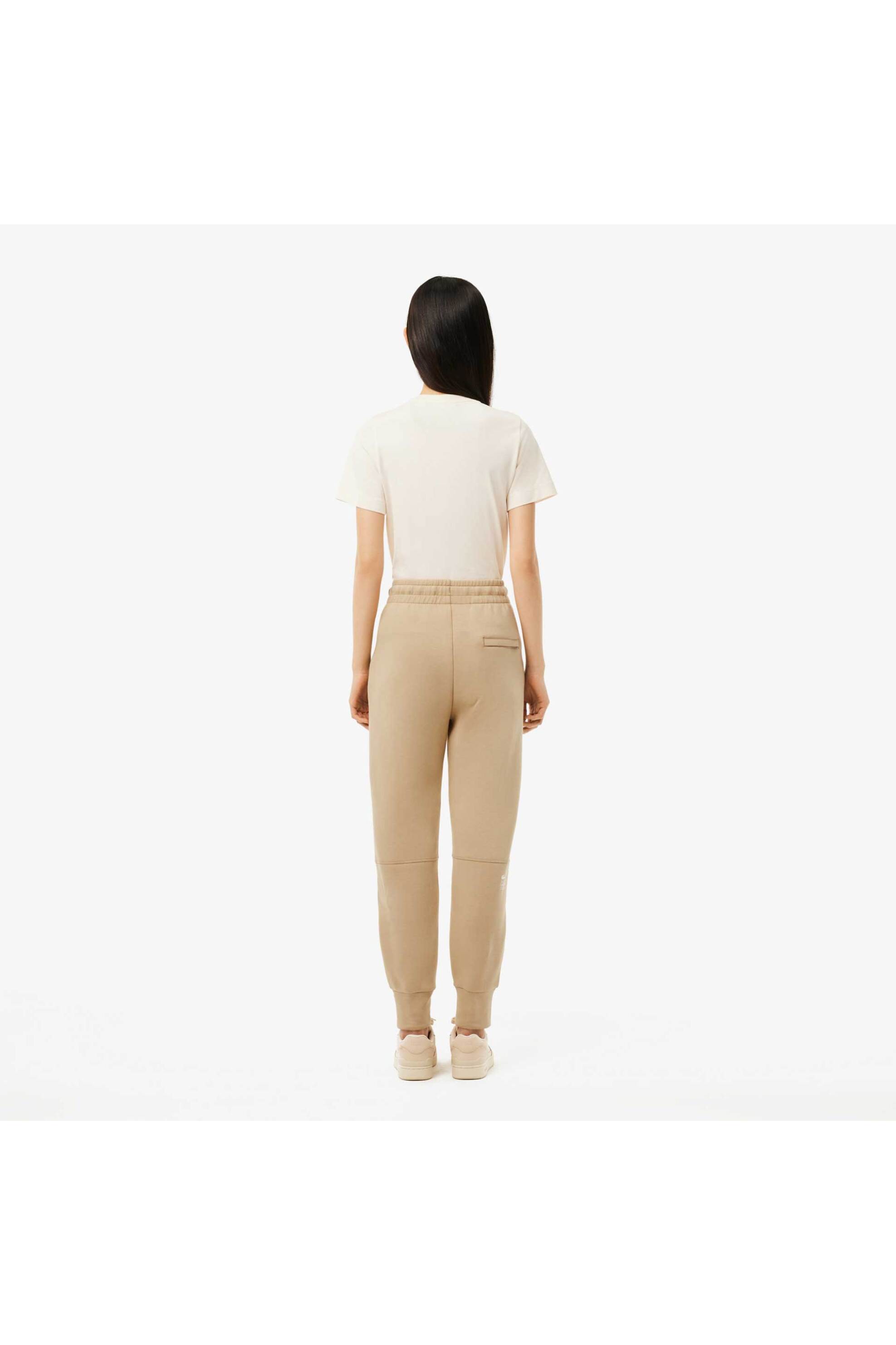 Lacoste γυναικείο παντελόνι φόρμας με λογότυπο Tapered Fit - XF0343 Μπεζ φωτογραφία