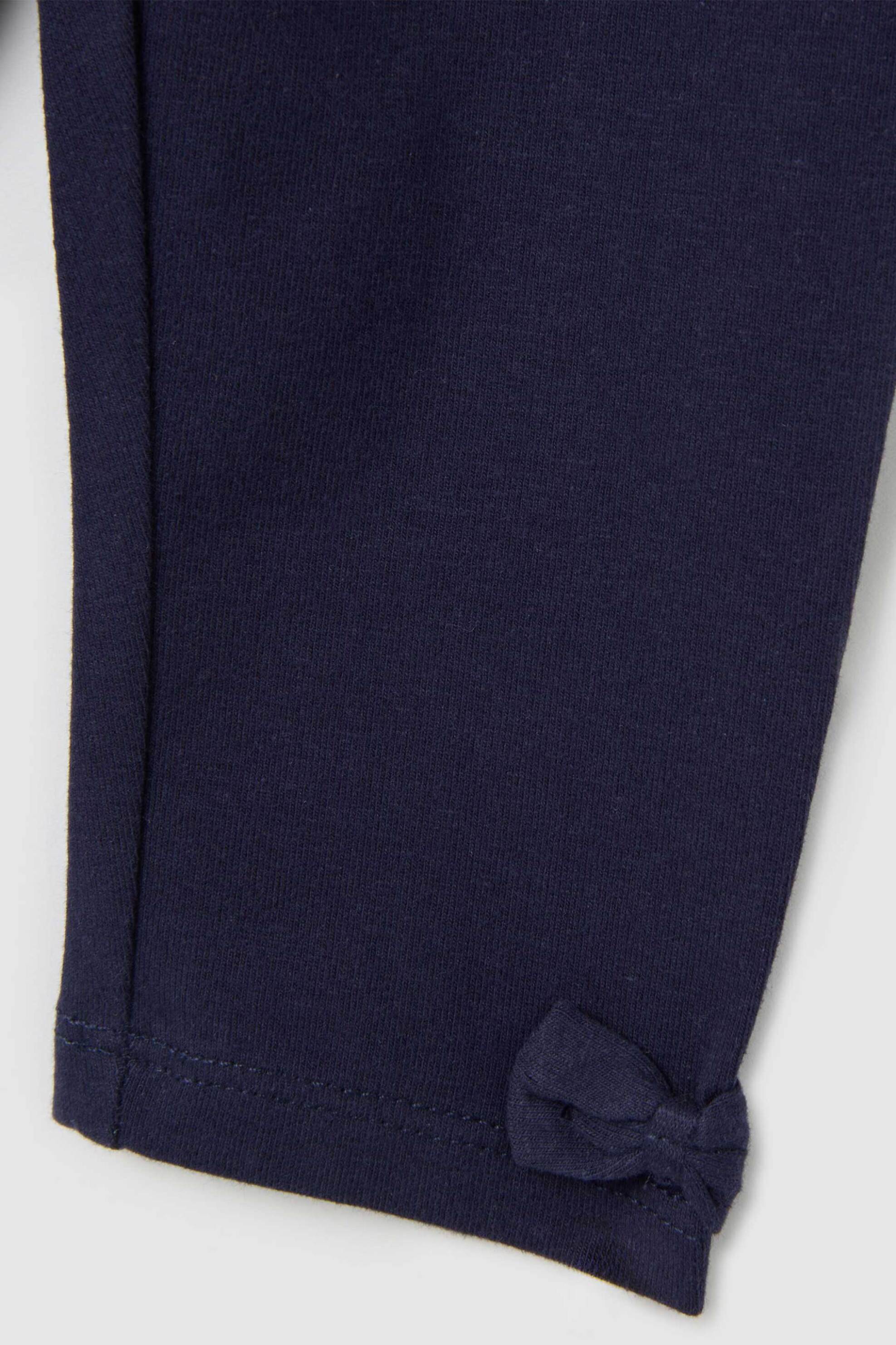 OVS βρεφικό κολάν μονόχρωμο με φιογκάκια στο κάτω μέρος Skinny Fit - 002443058 Μπλε Σκούρο φωτογραφία