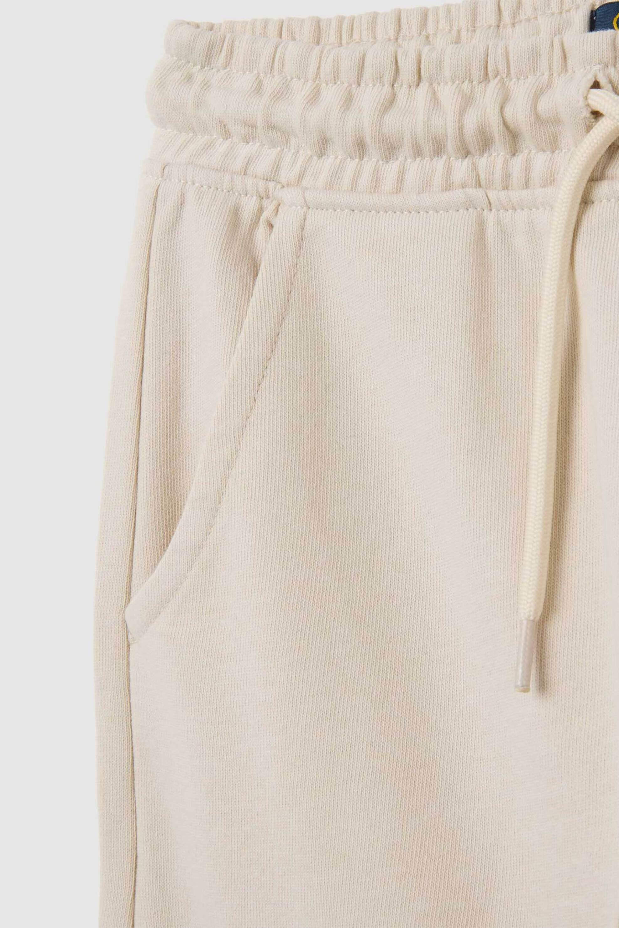 OVS παιδικό παντελόνι φόρμας με print Regular Fit - 002446096 Εκρού φωτογραφία