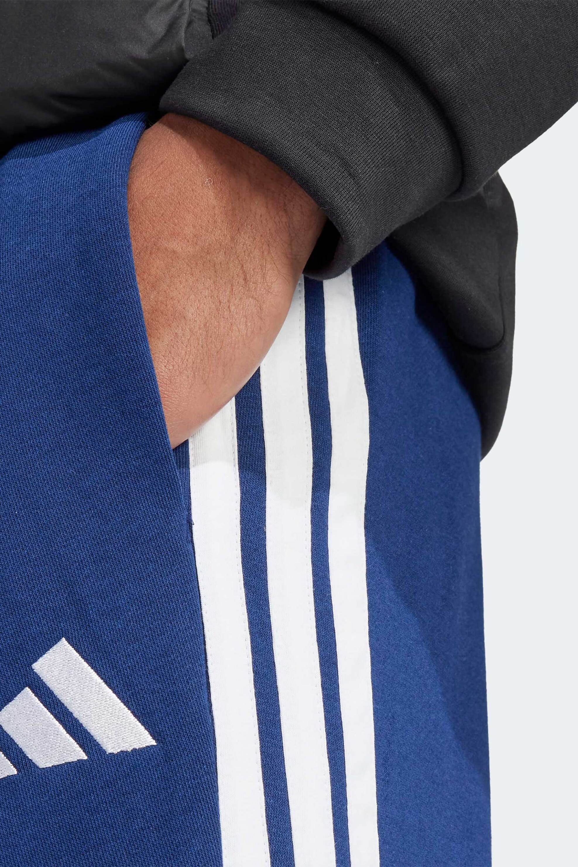Adidas ανδρικό παντελόνι φόρμας Regular Fit "Essentials 3-Stripes Open Hem Fleece" - JE6334 Μπλε φωτογραφία
